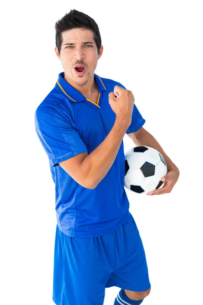 Glada fotbollsspelare i blå firar — Stockfoto