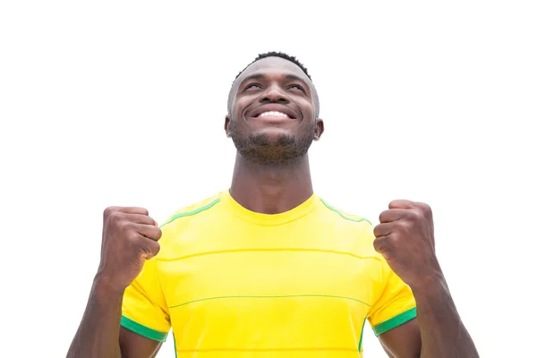 Jogador de futebol em amarelo celebrando uma vitória — Fotografia de Stock