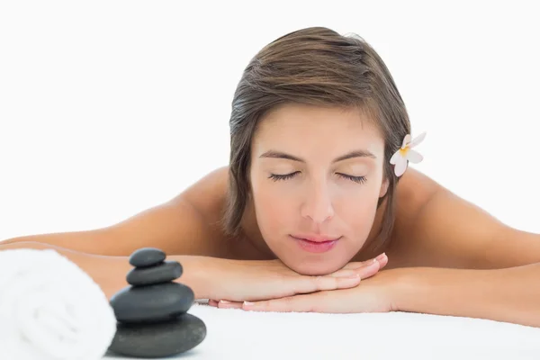 Close up of a beautiful young woman on massage table — Stock Photo, Image