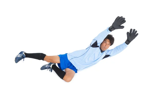 Goleiro em azul fazendo um salvamento — Fotografia de Stock