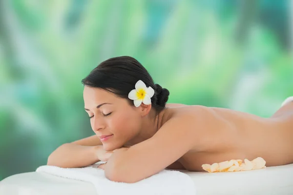 Brunette relaxing on massage table — Stock Photo, Image