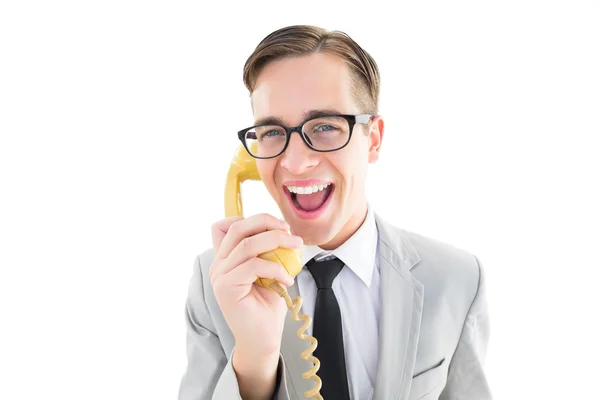 Nördiga affärsman talar retro telefon — Stockfoto