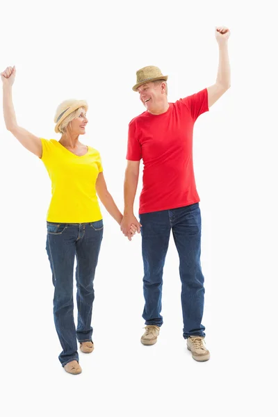 Mature couple walking and holding hands — Stock Photo, Image