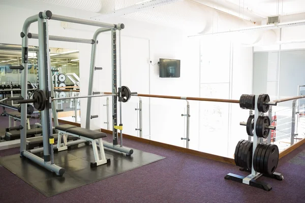 Empty weights room with bench press — Stock Photo, Image