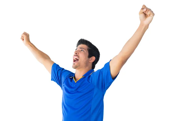 Feliz jugador de fútbol en azul celebrando — Foto de Stock