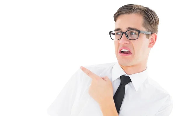 Geeky young hipster pointing with disgust — Stock Photo, Image