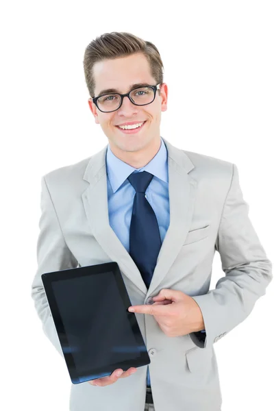 Geeky businessman pointing to tablet pc — Stock Photo, Image