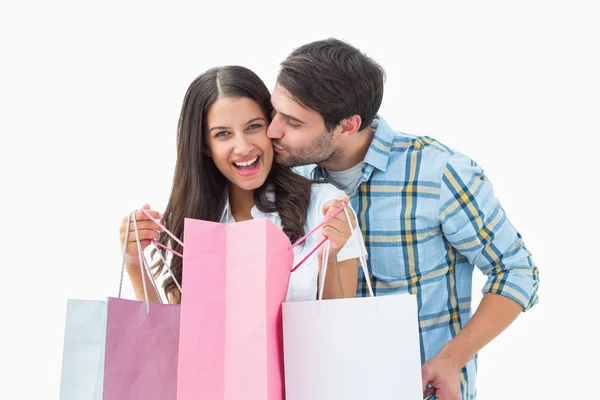 Casal jovem atraente com sacos de compras — Fotografia de Stock