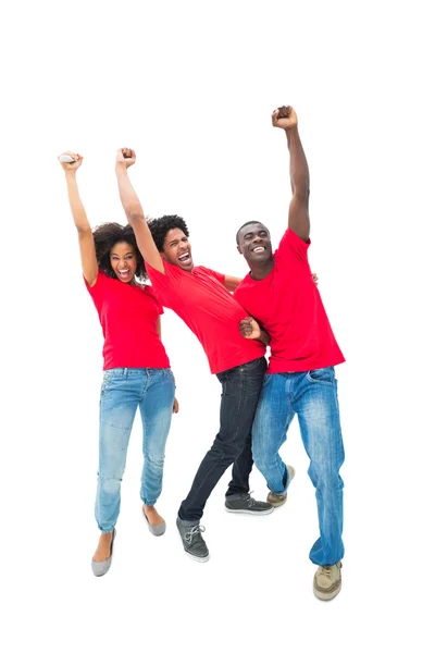 Excited football fans in red cheering — Stock Photo, Image