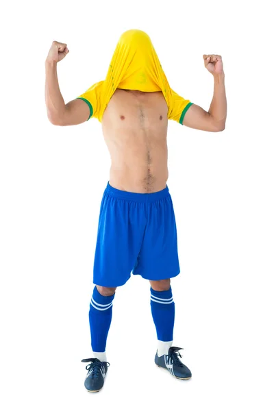 Szczęśliwy piłkarz świętować żółty — Zdjęcie stockowe