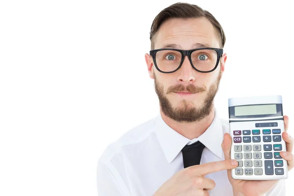 Geeky businessman pointing to calculator — Stock Photo, Image