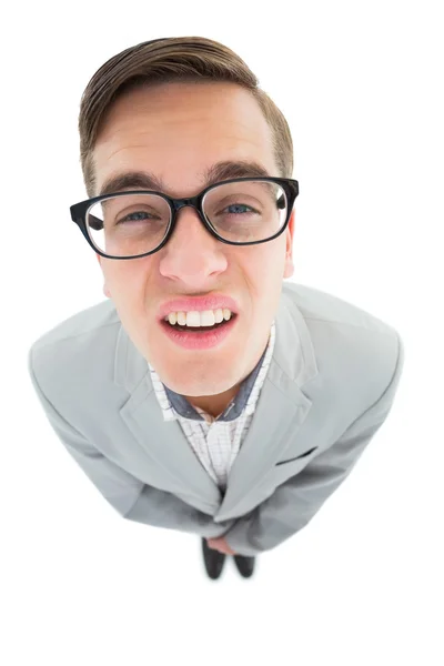 Geeky hipster fronsen op camera — Stockfoto