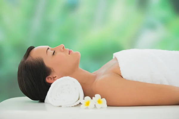 Brunette relaxing on massage table — Stock Photo, Image