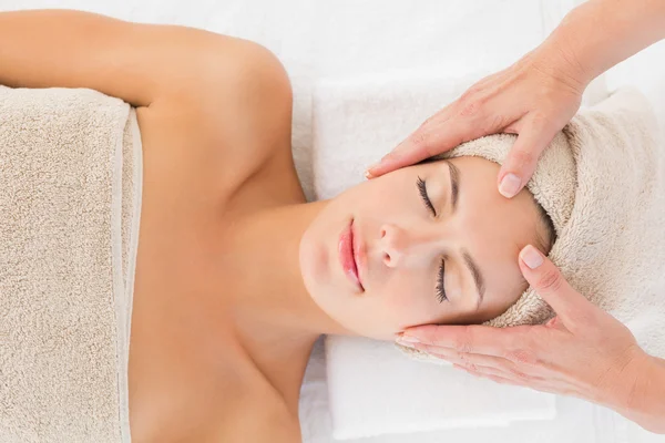 Attractive woman receiving facial massage at spa center — Stock Photo, Image