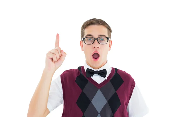 Geeky hipster looking at camera and pointing up — Stock Photo, Image