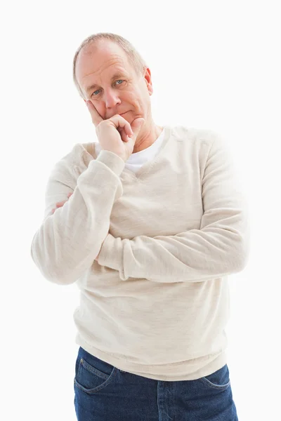 Thinking mature man with hand on chin — Stock Photo, Image