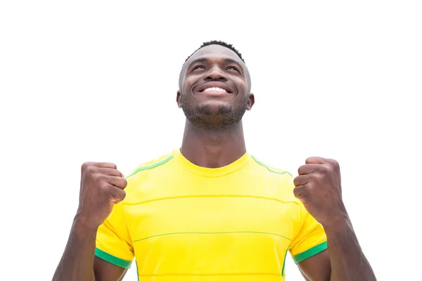 Football player in yellow celebrating a win Stock Picture