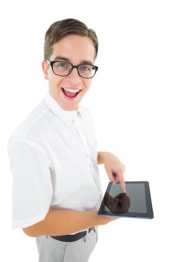 Geeky businessman using his tablet pc clipart