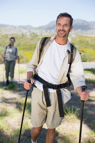 Happy hiking couple walking on mountain trail — Stock Photo, Image