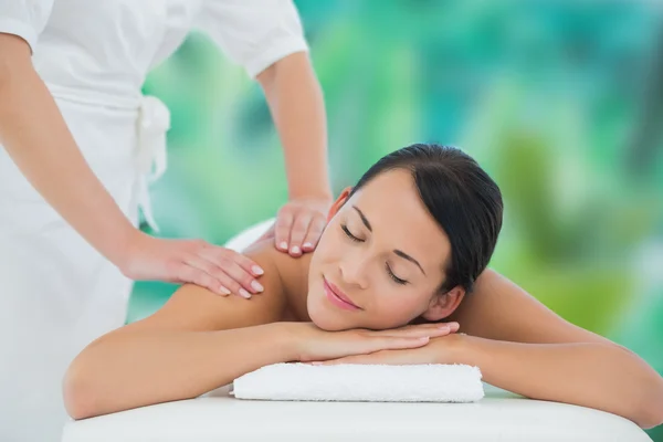 Brunette enjoying back massage — Stock Photo, Image