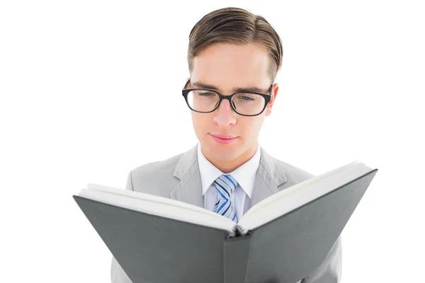 Geeky preacher reading from black bible — Stock Photo, Image