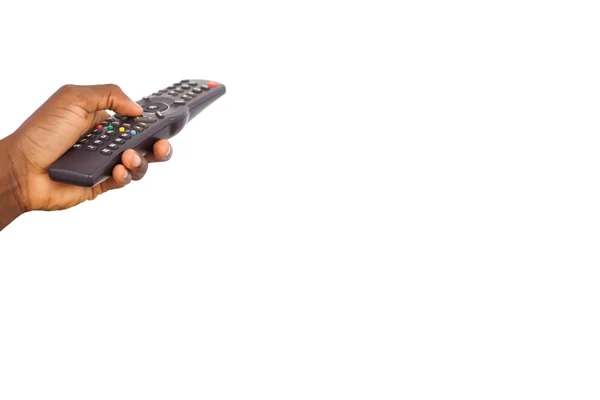 Mans hand holding remote control — Stock Photo, Image