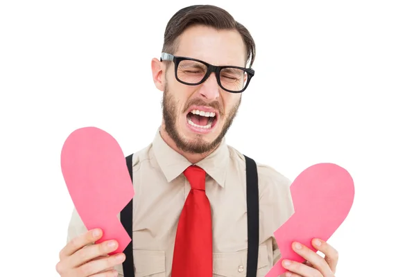 Geeky hipster crying and holding broken heart card — Stock Photo, Image