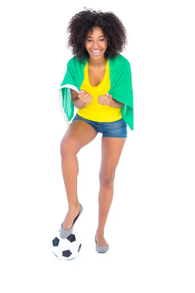 Pretty football fan holding brazilian flag — Stock Photo, Image