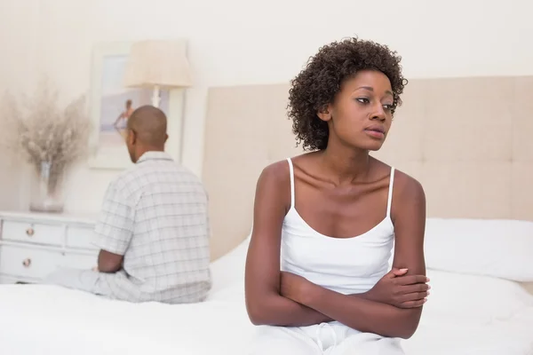 Unhappy couple not speaking to each other on bed — Stock Photo, Image