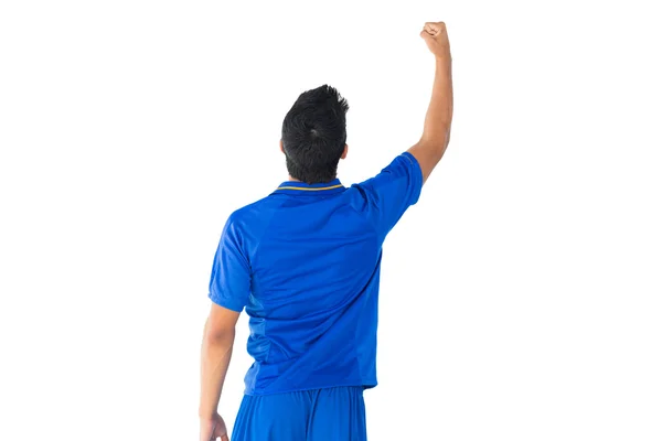 Jogador de futebol feliz em azul comemorando — Fotografia de Stock