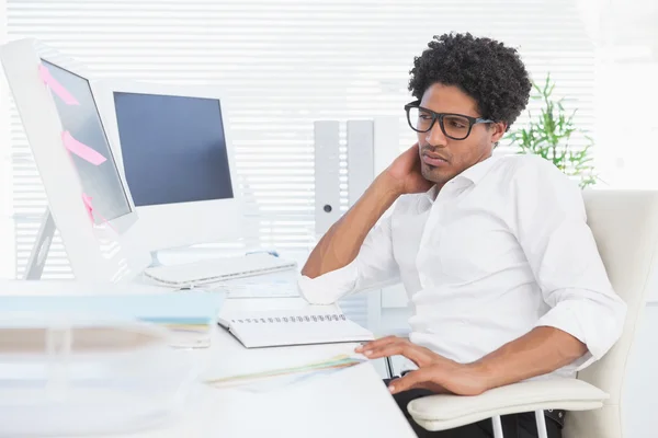 Hipster businessman working at his desk — Stock Photo, Image