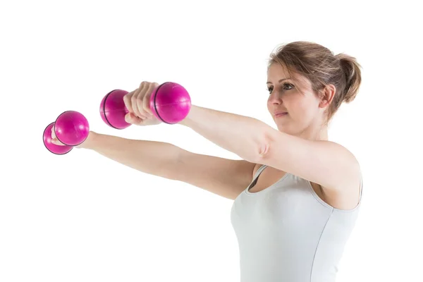 Young woman exercising with dumbbells — Stock Photo, Image