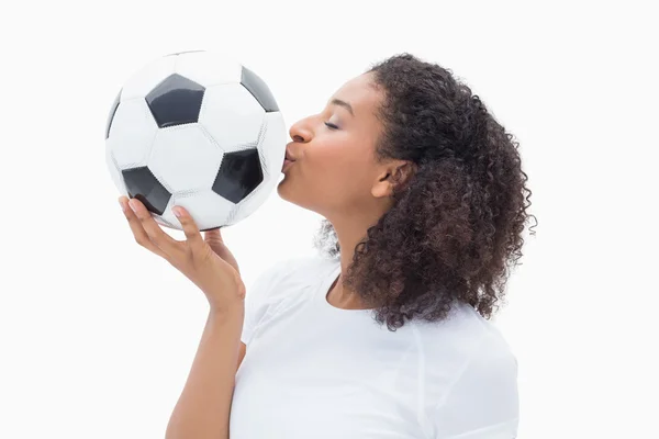 Pretty girl kissing her football — Stock Photo, Image