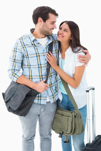 Attractive young couple going on their holidays — Stock Photo, Image