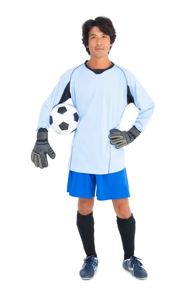 Goalkeeper in blue holding ball — Stock Photo, Image