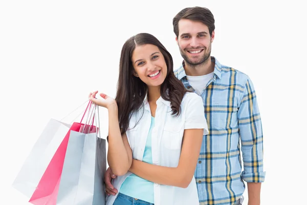 Atractiva pareja joven con bolsas de compras —  Fotos de Stock