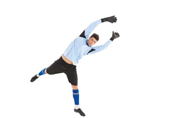 Goalkeeper in blue jumping up — Stock Photo, Image