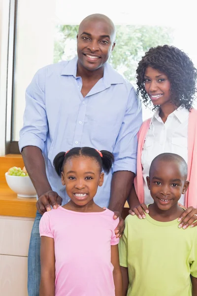 Happy family standing and smiling at camera — Stock Photo, Image