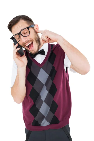 Geeky hipster praten over een retro cellphone — Stockfoto