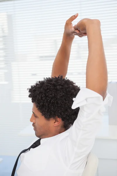 Happy businessman stretching his arms — Stock Photo, Image