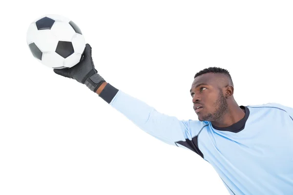 Goleiro em azul fazendo um salvamento — Fotografia de Stock