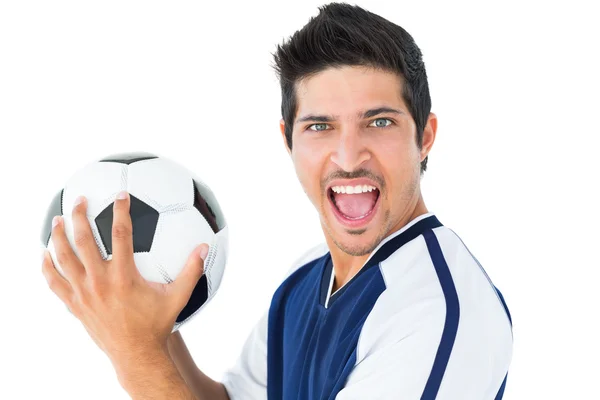 Jogador de futebol feliz em azul segurando a bola — Fotografia de Stock