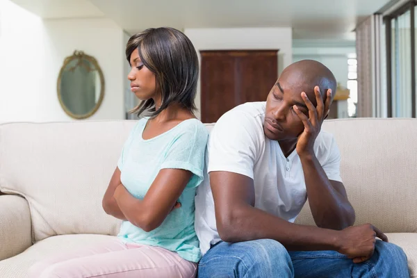 Unhappy couple not talking after argument on sofa — Stock Photo, Image