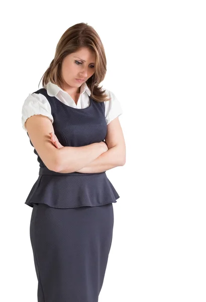 Thoughtful young businesswoman with arms crossed — Stock Photo, Image