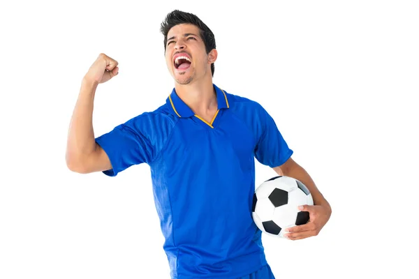 Šťastný fotbalista v modré slaví — Stock fotografie