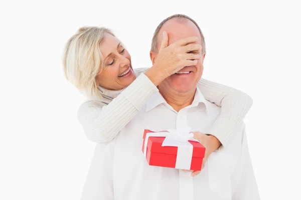 Older woman holding present — Stock Photo, Image