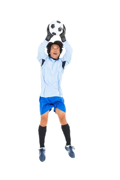 Goalkeeper in blue saving ball — Stock Photo, Image