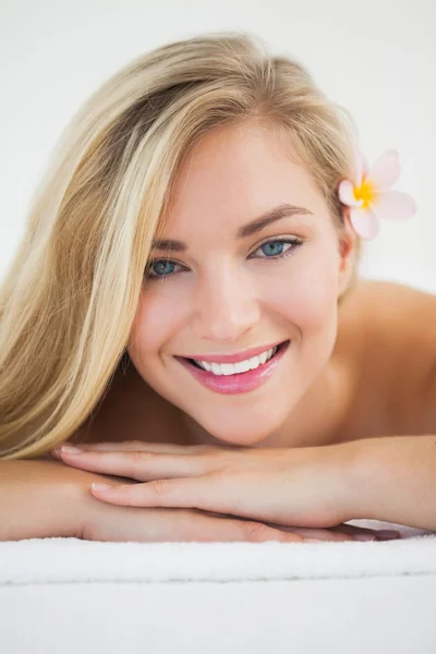 Beautiful blonde lying on massage table — Stock Photo, Image