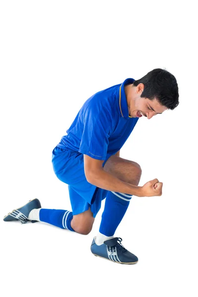 Feliz jugador de fútbol en azul celebrando —  Fotos de Stock