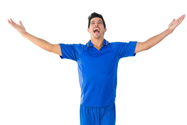 Feliz jugador de fútbol en azul celebrando — Foto de Stock